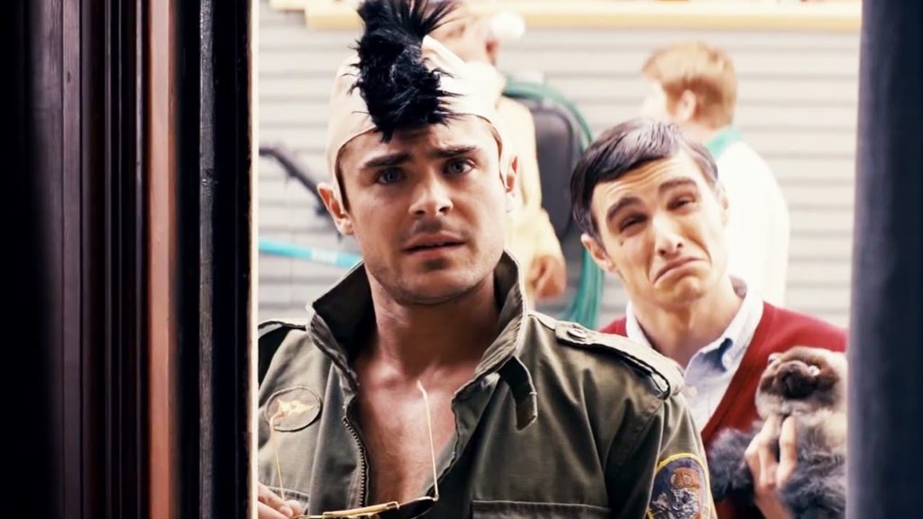 Teddy (Zac Efron) and Pete (Dave Franco); both dressed as Robert De Niro