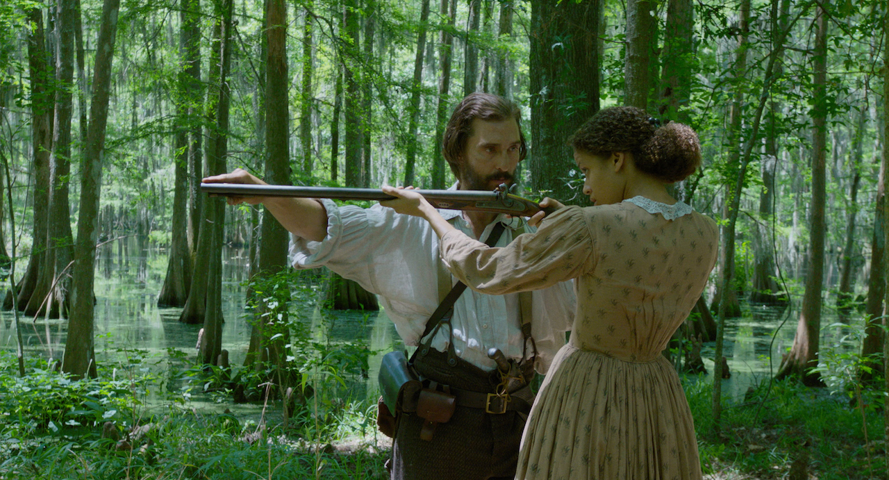 Shooting lessons for all in FREE STATE OF JONES. McConaughey with Gugu-Mbatha-Raw.