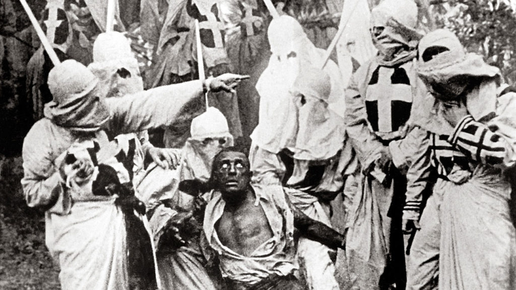 The Birth of a Nation (1915) Directed by D.W. Griffith Shown: Walter Long (as Gus) surrounded by Ku Klux Klan members