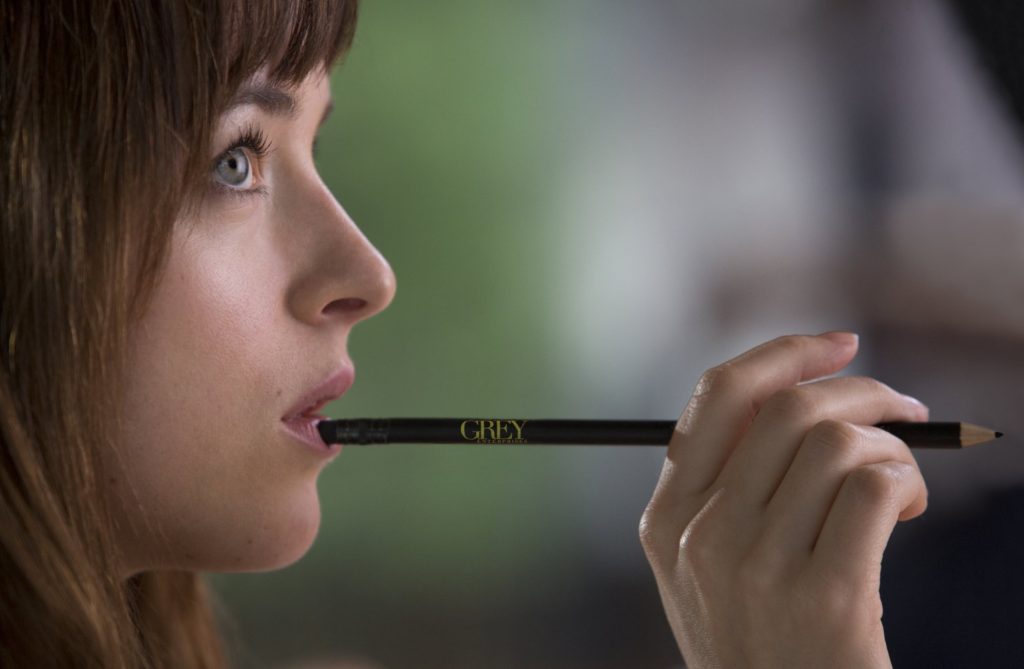 Dakota Johnson in FIFTY SHADES OF GREY