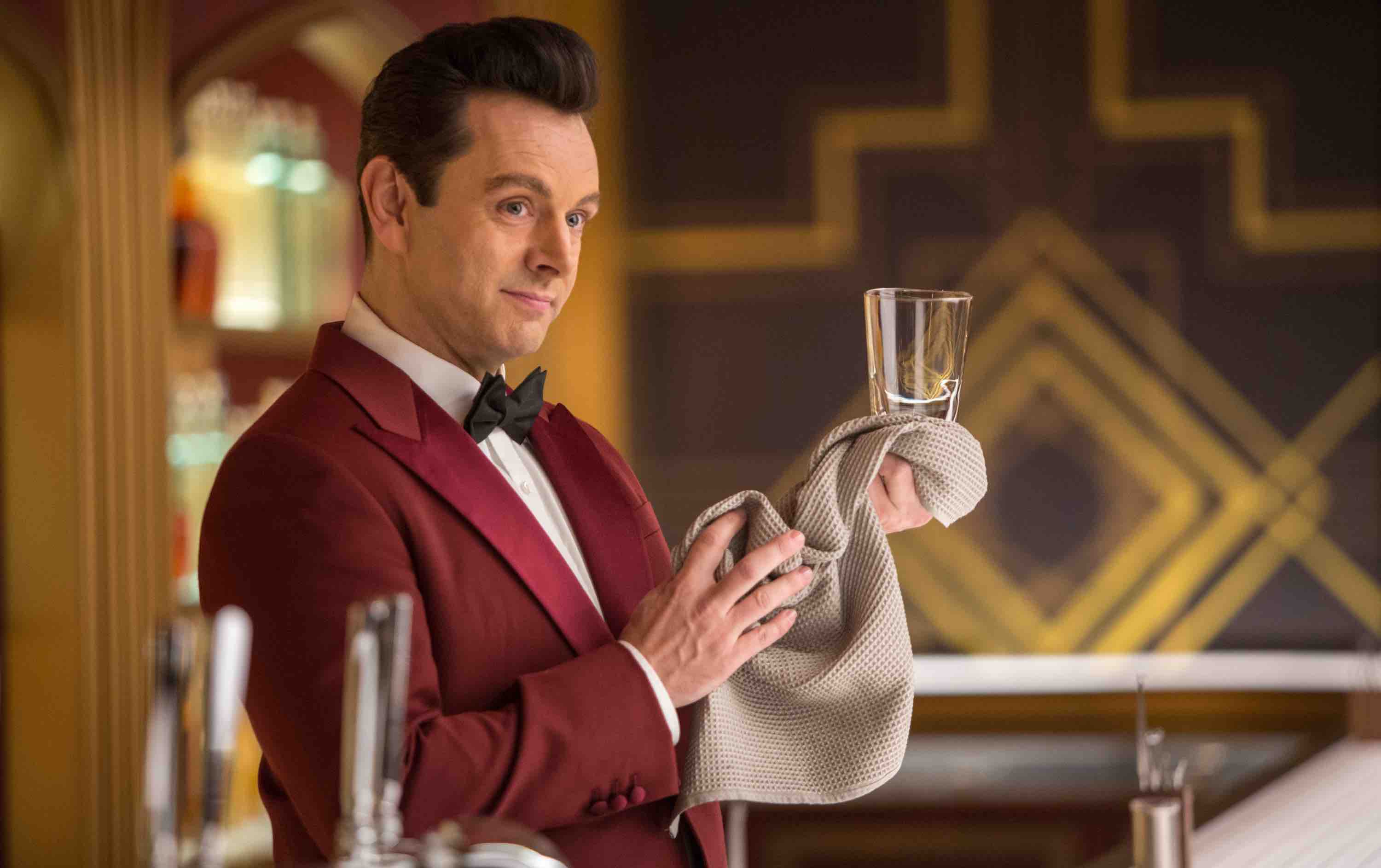 Bartender Arthur (MICHAEL SHEEN) behind the Grand Concourse Bar in Columbia Pictures' PASSENGERS.