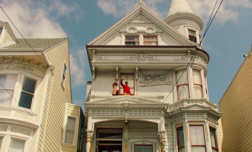 Jonathan Majors and Jimmie Fails wave on the balcony of Jimmie's grandfather's house in THE LAST BLACK MAN IN SAN FRANCSICO (2019)