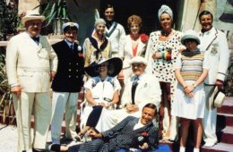 The cast of EVIL UNDER THE SUN, Roddy McDowall (reclining), seated from left: Sylvia Miles, James Mason, standing from left: Peter Ustinov, Colin Blakely, Jane Birkin, Nicholas Clay, Maggie Smith, Diana Rigg, Emily Hone, Denis Quilley, 1982.