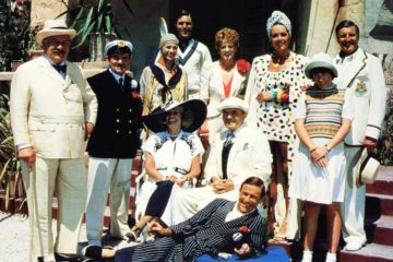 The cast of EVIL UNDER THE SUN, Roddy McDowall (reclining), seated from left: Sylvia Miles, James Mason, standing from left: Peter Ustinov, Colin Blakely, Jane Birkin, Nicholas Clay, Maggie Smith, Diana Rigg, Emily Hone, Denis Quilley, 1982.