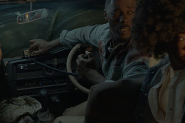 Iyana Halley, Idris Elba, and Leah Jeffries hide from a lion inside their vehicle in BEAST (2022)
