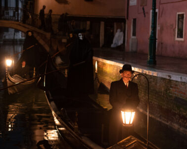 (L-R): Riccardo Scamarcio as Vitale Portfoglio and Kenneth Branagh as Hercule Poirot in 20th Century Studios' A HAUNTING IN VENICE. Photo by Rob Youngson. © 2023 20th Century Studios. All Rights Reserved.