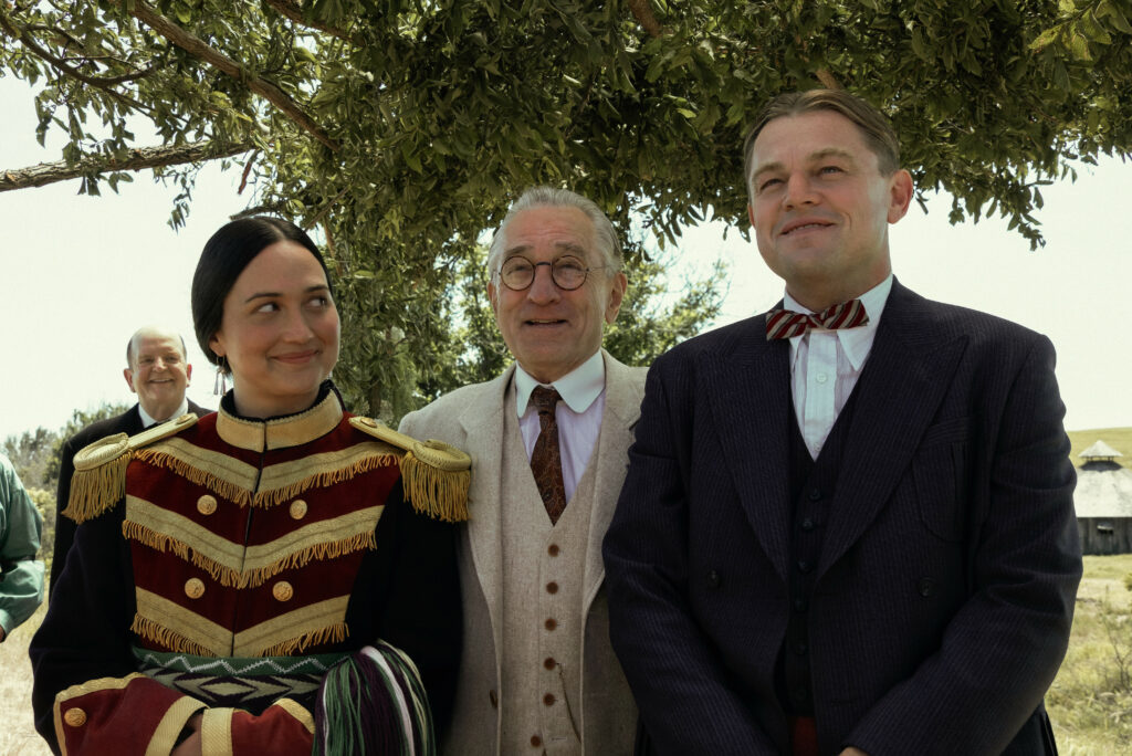 Lily Gladstone, Robert De Niro, and Leonardo DiCaprio in KILLERS OF THE FLOWER MOON (2023)