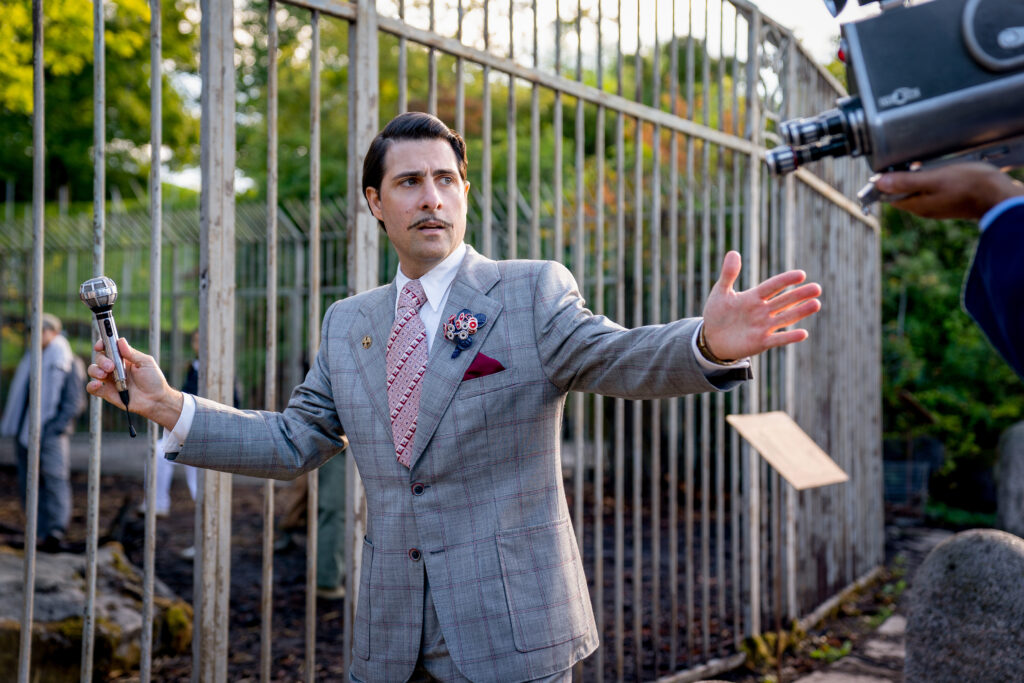 Jason Schwartzman as Lucretius 'Lucky' Flickerman in The Hunger Games: The Ballad of Songbirds and Snakes. Photo Credit: Murray Close