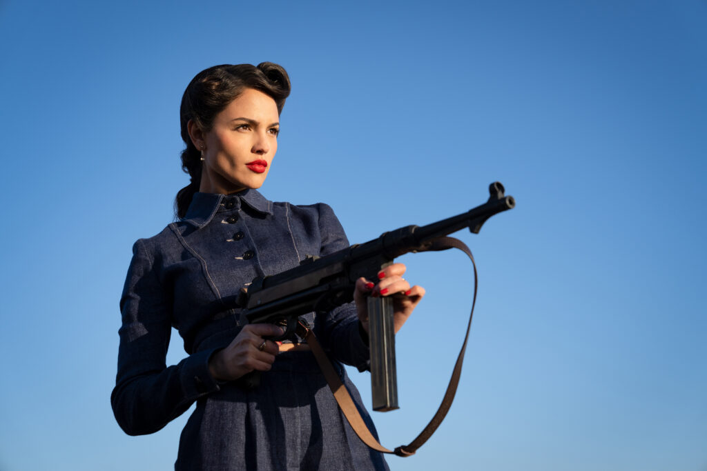 Eiza González shoots a gun in THE MINISTRY OF UNGENTLEMANLY WARFARE (2024)