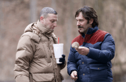 Tim Robinson and Paul Rudd examine a mushroom in the woods in FRIENDSHIP (2025)