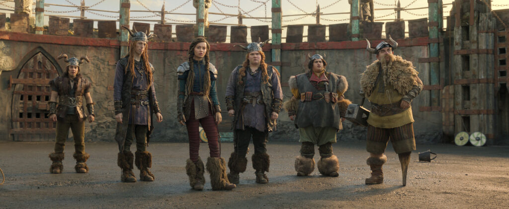 (from left) Snotlout (Gabriel Howell), Tuffnut (Harry Trevaldwyn), Astrid (Nico Parker), Ruffntut (Bronwyn James), Fishlegs (Julian Dennison) and Gobber (Nick Frost) in Universal Pictures’ live-action How to Train Your Dragon, written and directed by Dean DeBlois.