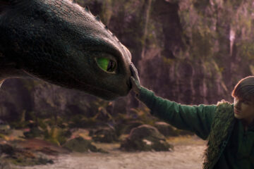 Mason Thames (right) as Hiccup with his Night Fury dragon, Toothless, in Universal Pictures’ live-action How to Train Your Dragon, written and directed by Dean DeBlois.