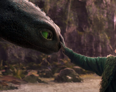 Mason Thames (right) as Hiccup with his Night Fury dragon, Toothless, in Universal Pictures’ live-action How to Train Your Dragon, written and directed by Dean DeBlois.
