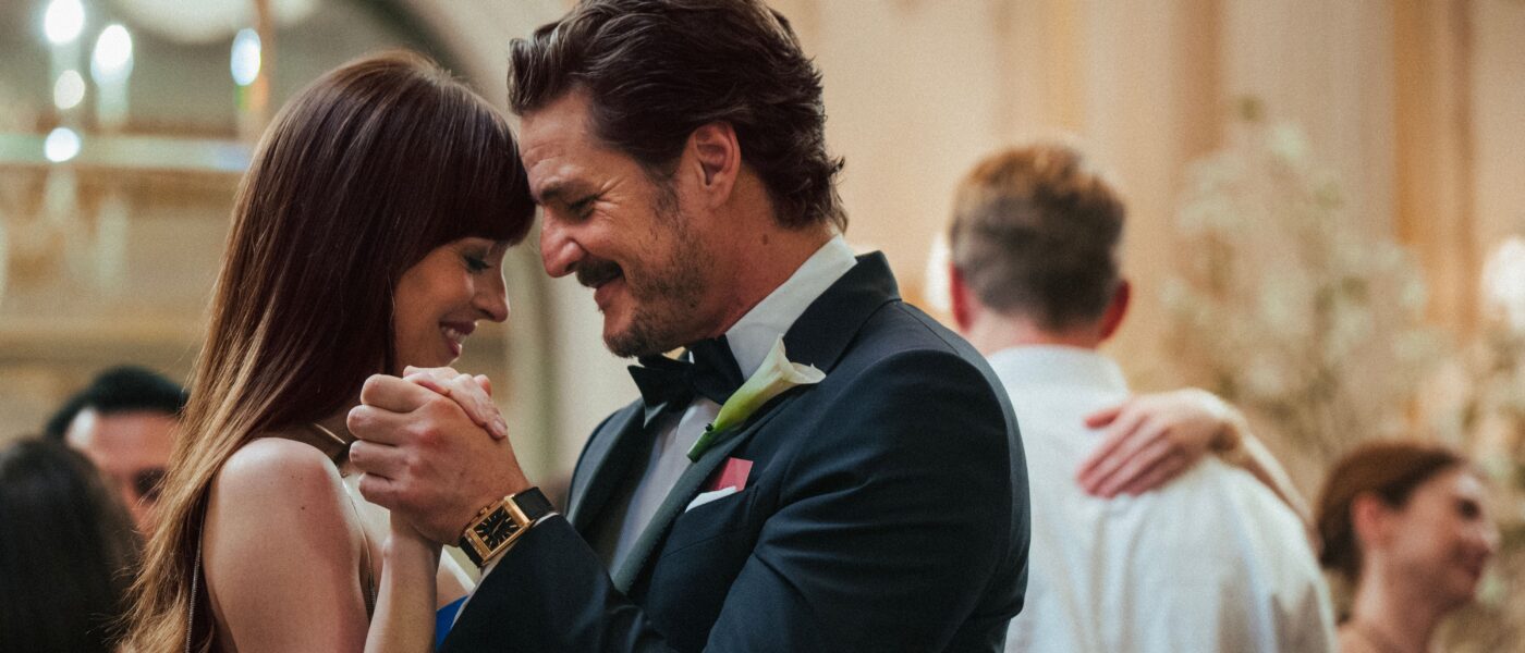 Dakota Johnson and Pedro Pascal dance at a wedding in MATERIALISTS (2025)