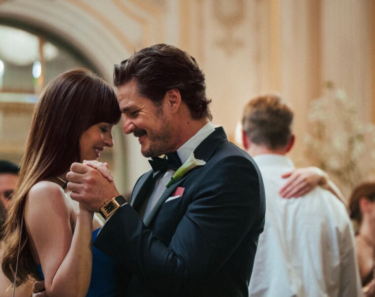 Dakota Johnson and Pedro Pascal dance at a wedding in MATERIALISTS (2025)