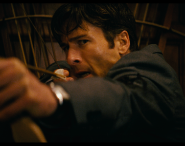 Glen Powell aims an arrow in HOW TO MAKE A KILLING (2026)