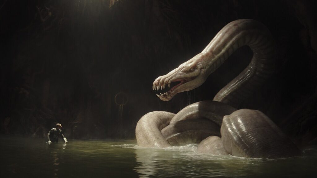 The Mandalorian (Pedro Pascal) faces off with a giant creature in STAR WARS: THE MANDALORIAN AND GROGU (2026)